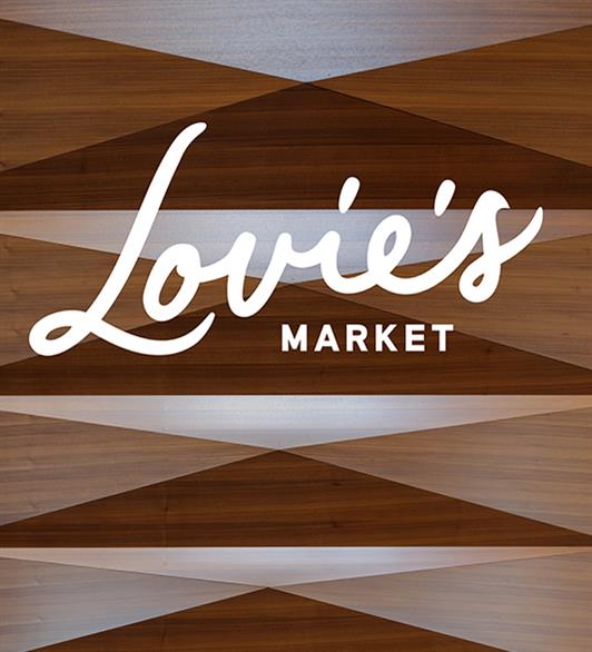 The Lovie's logo in front of a wood board