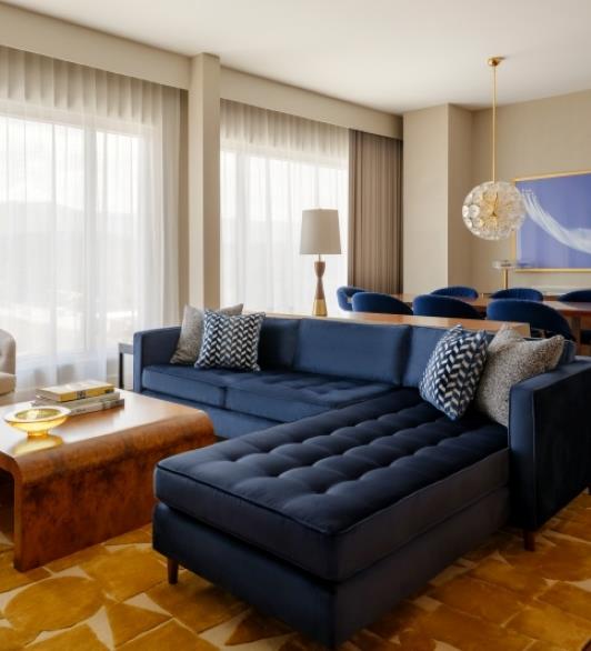 A couch in the Summit view suites room