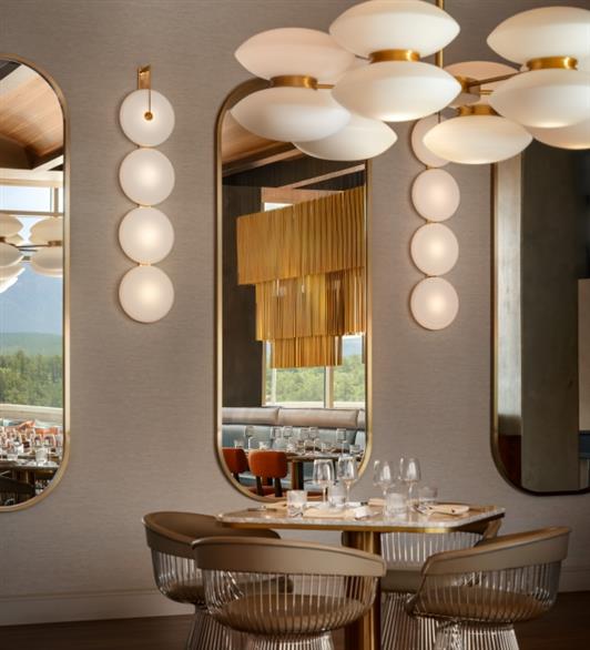 A mirror with tables in front of it
