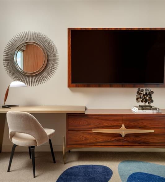 A desk next to a TV