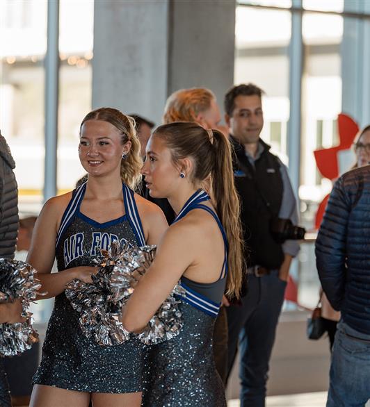 Cheerleaders standing around