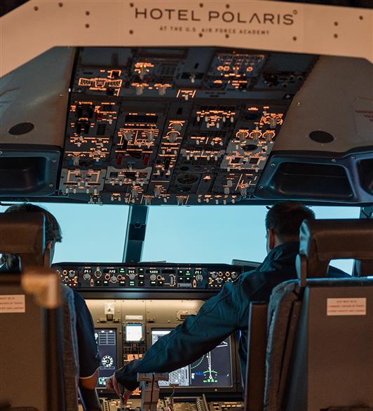 Two people in the flight simulator