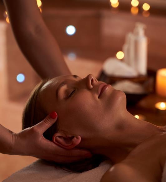 Lady getting her face massaged