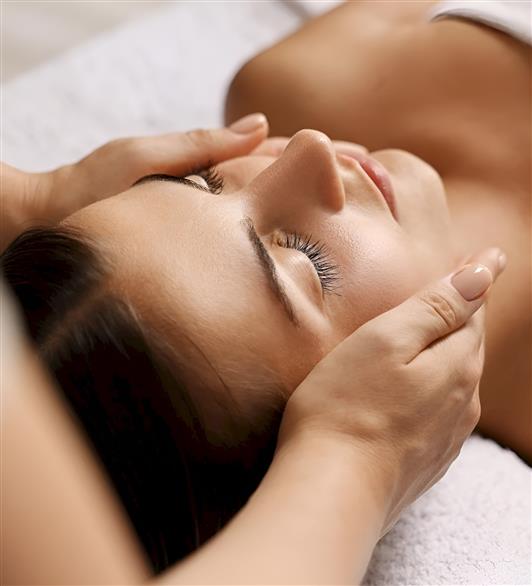 Someone getting their face massaged