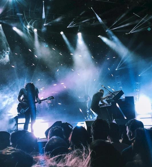 People on stage at a concert