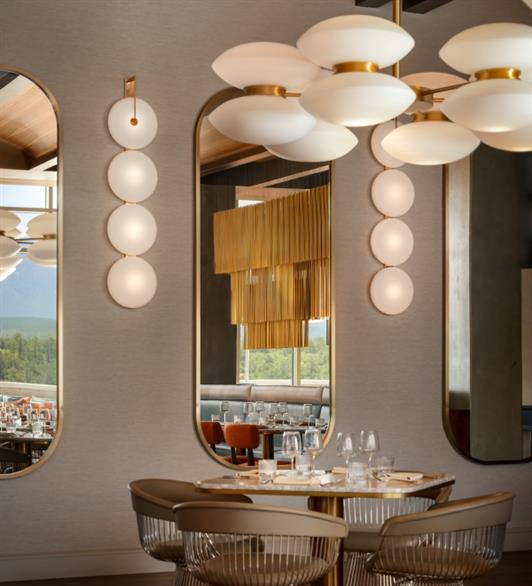 Dinner seating with a mirror behind it