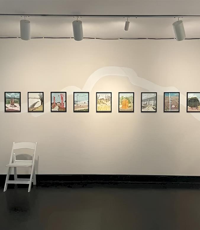 A chair next to paintings