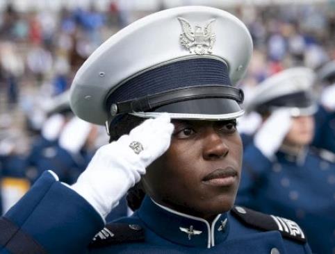 An academy cadet saluting
