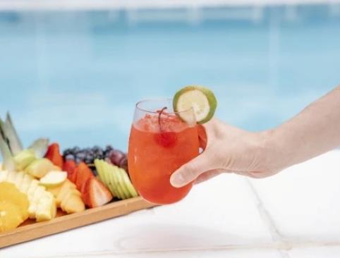 Someone holding a red drink